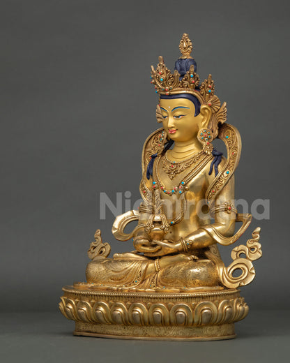 left-side profile of Amitayus sculpture with fire-gilded copper craftsmanship