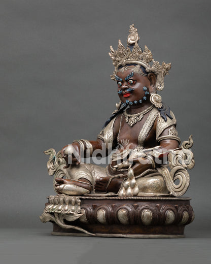 Left side view of Dzambhala wealth guardian statue handcrafted oxidized copper Buddhist sculpture