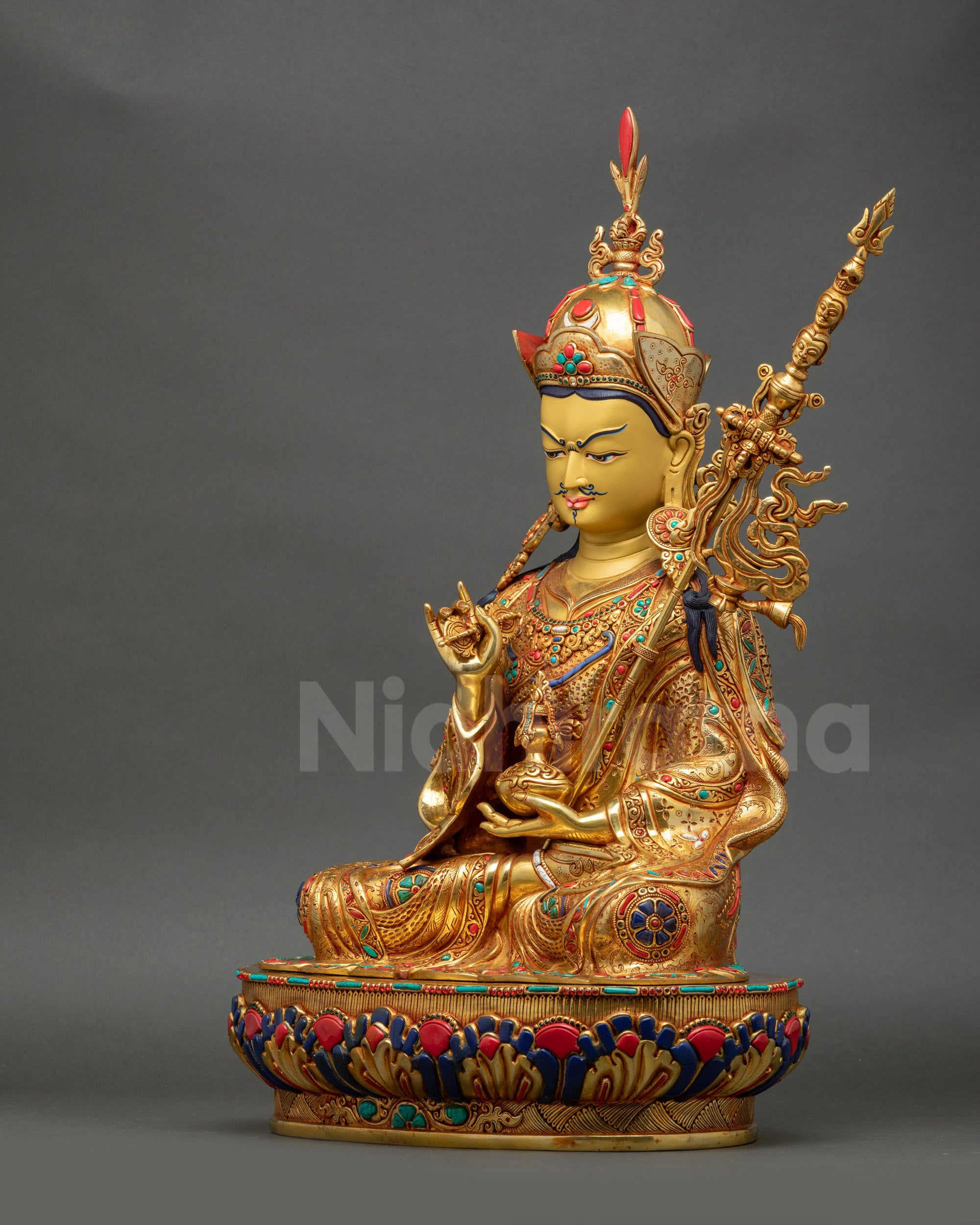 Left-angle view of Tsokye Dorje Statue showing floral filigree on kasaya and ornaments