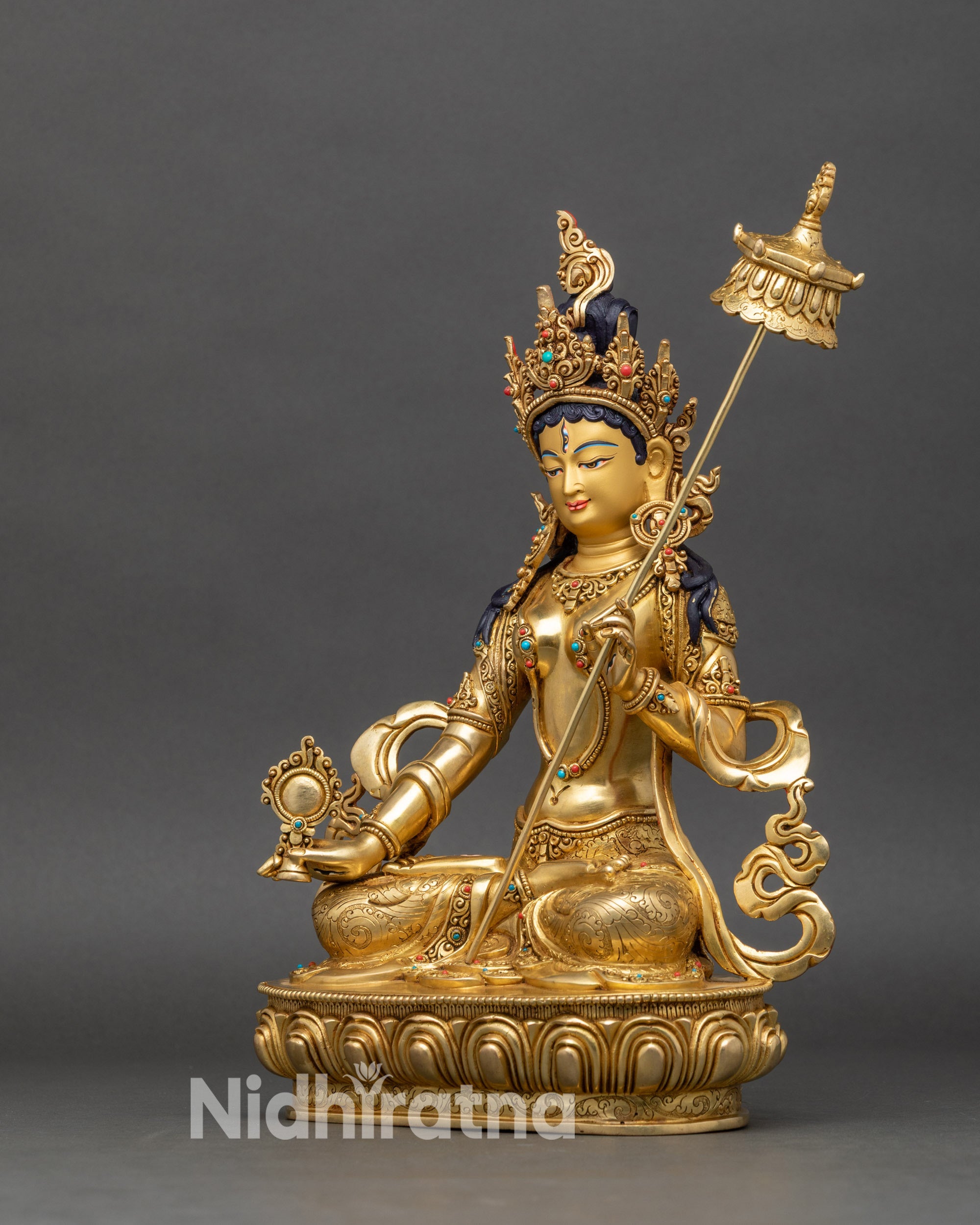 Left profile of Dukar statue, gold-gilded copper, adorned with turquoise and coral