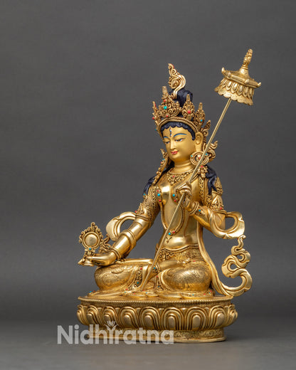 Left profile of Dukar statue, gold-gilded copper, adorned with turquoise and coral