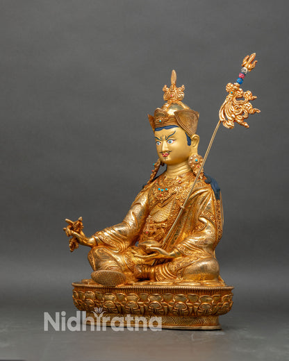 Left profile of Guru Rinpoche statue, copper and gold Padmasambhava artwork