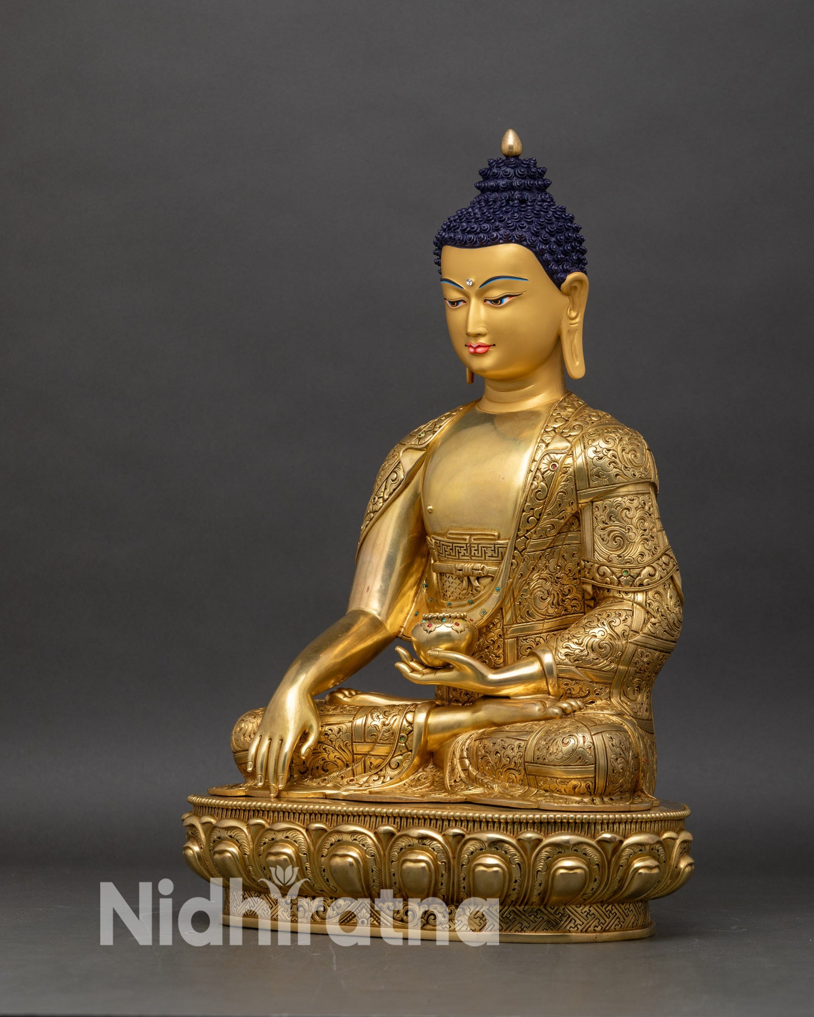 Left profile of Shakyamuni Buddha sculpture, seated Buddha on lotus with intricate carvings