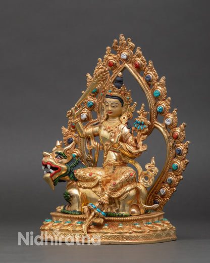 Left profile of Simhada Manjushri statue showing copper and gold details with lion symbol