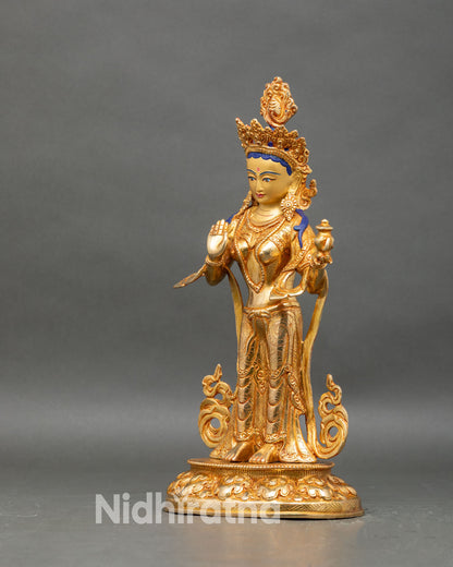 Left profile of Yeshe Tsogyal statue, detailed lotus pedestal and golden robes