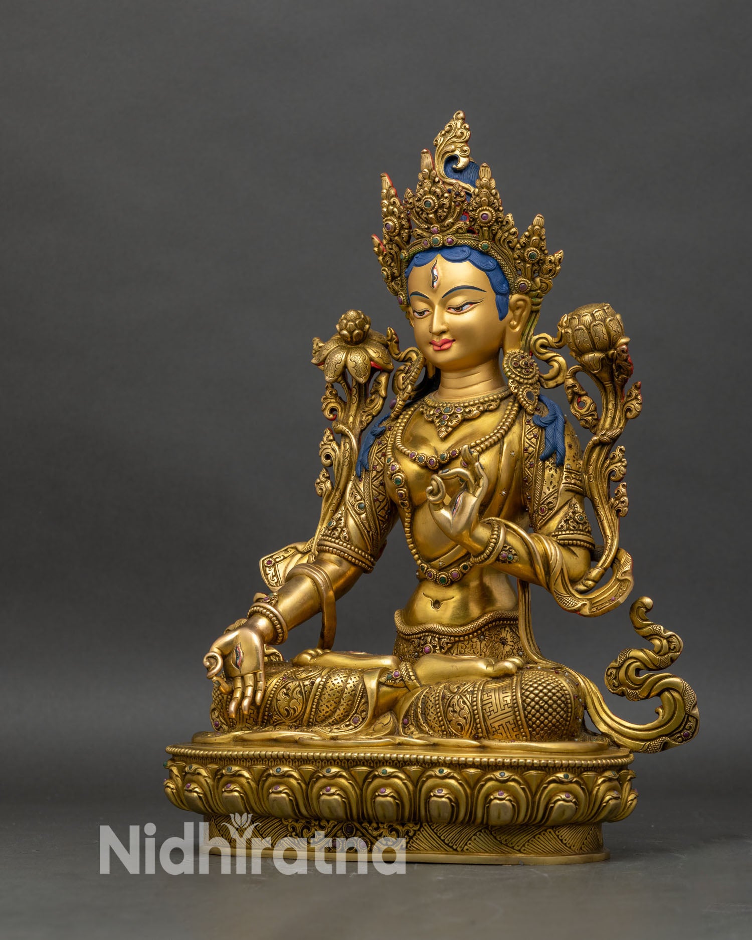 Left profile of White Tara statue, fire-gilded copper with intricate lotus seat
