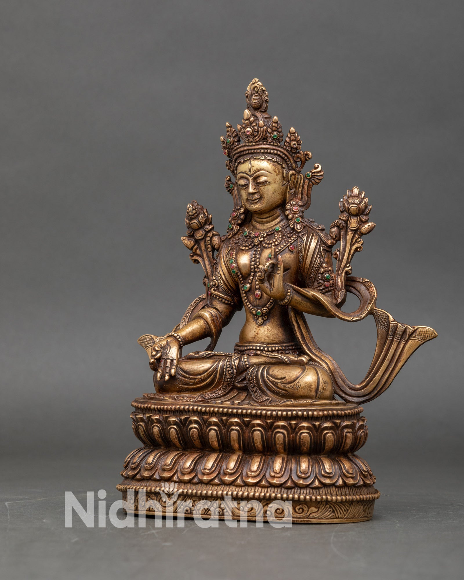 Left profile of White Tara sculpture, Newari handmade, oxidized finish, divine form
