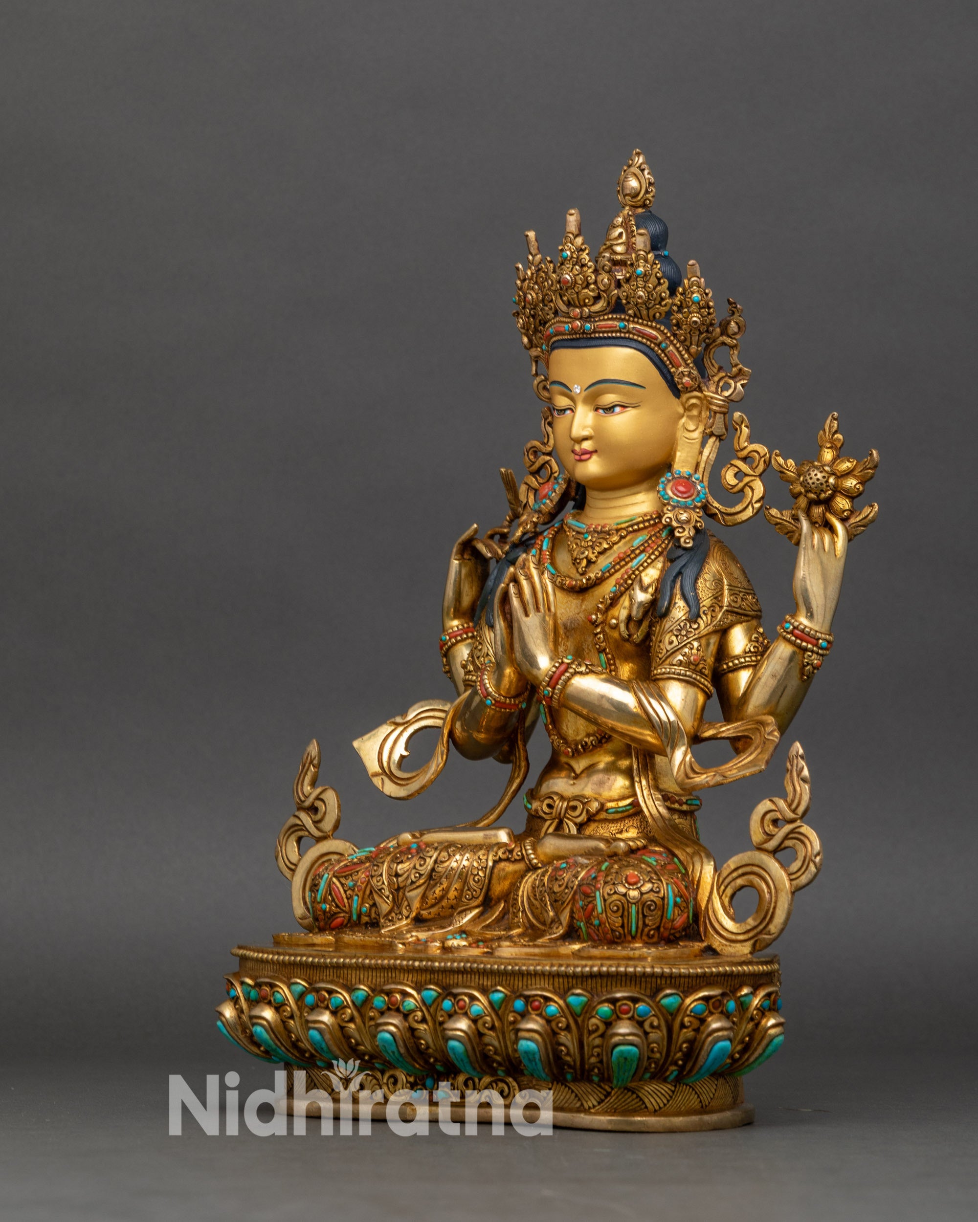Left side view of Avalokiteshvara statue, hand-set turquoise and coral, meditation pose
