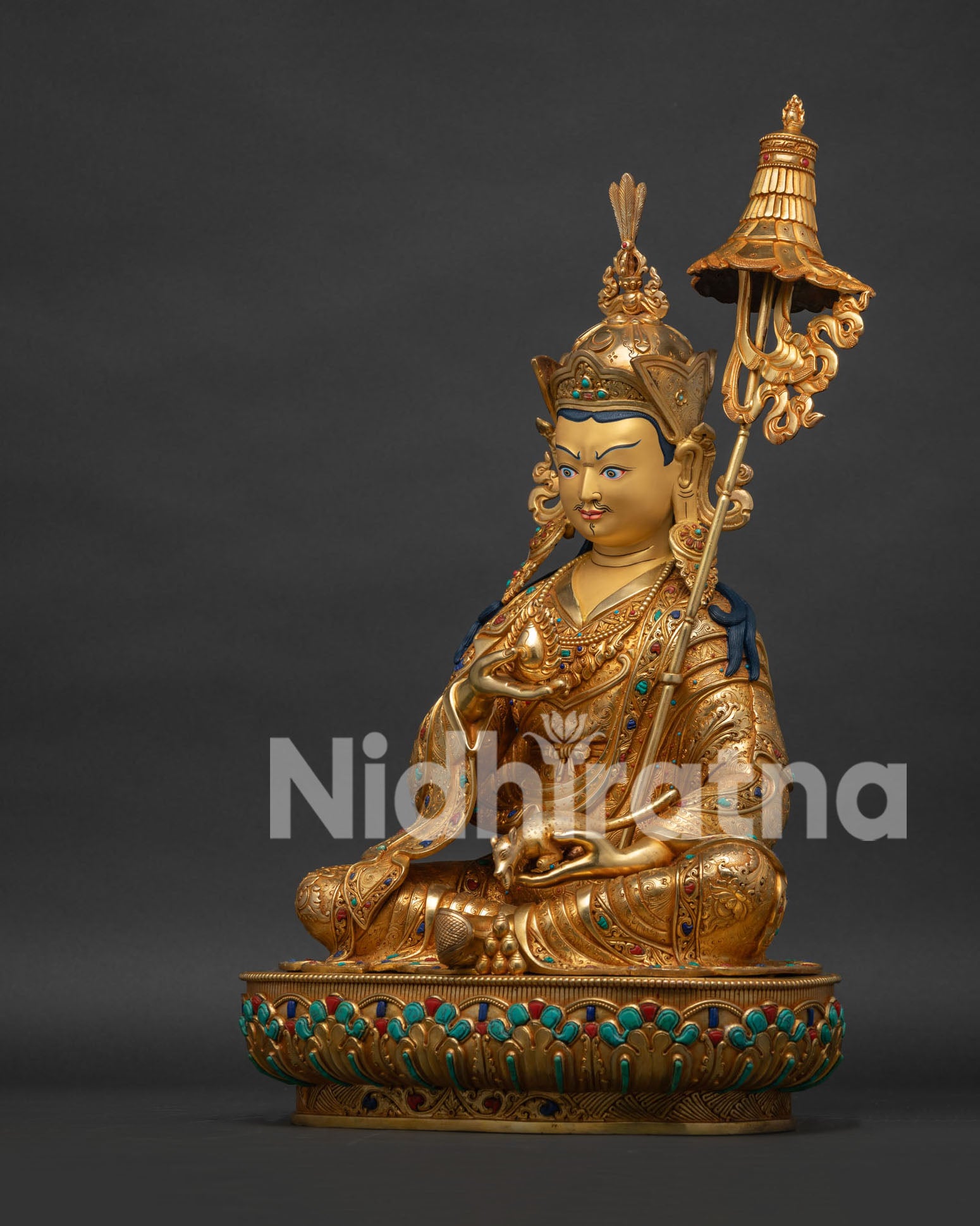 Left side view of Guru Norlha statue with jewel-spitting mongoose and Chintamani jewel, Patan Nepal