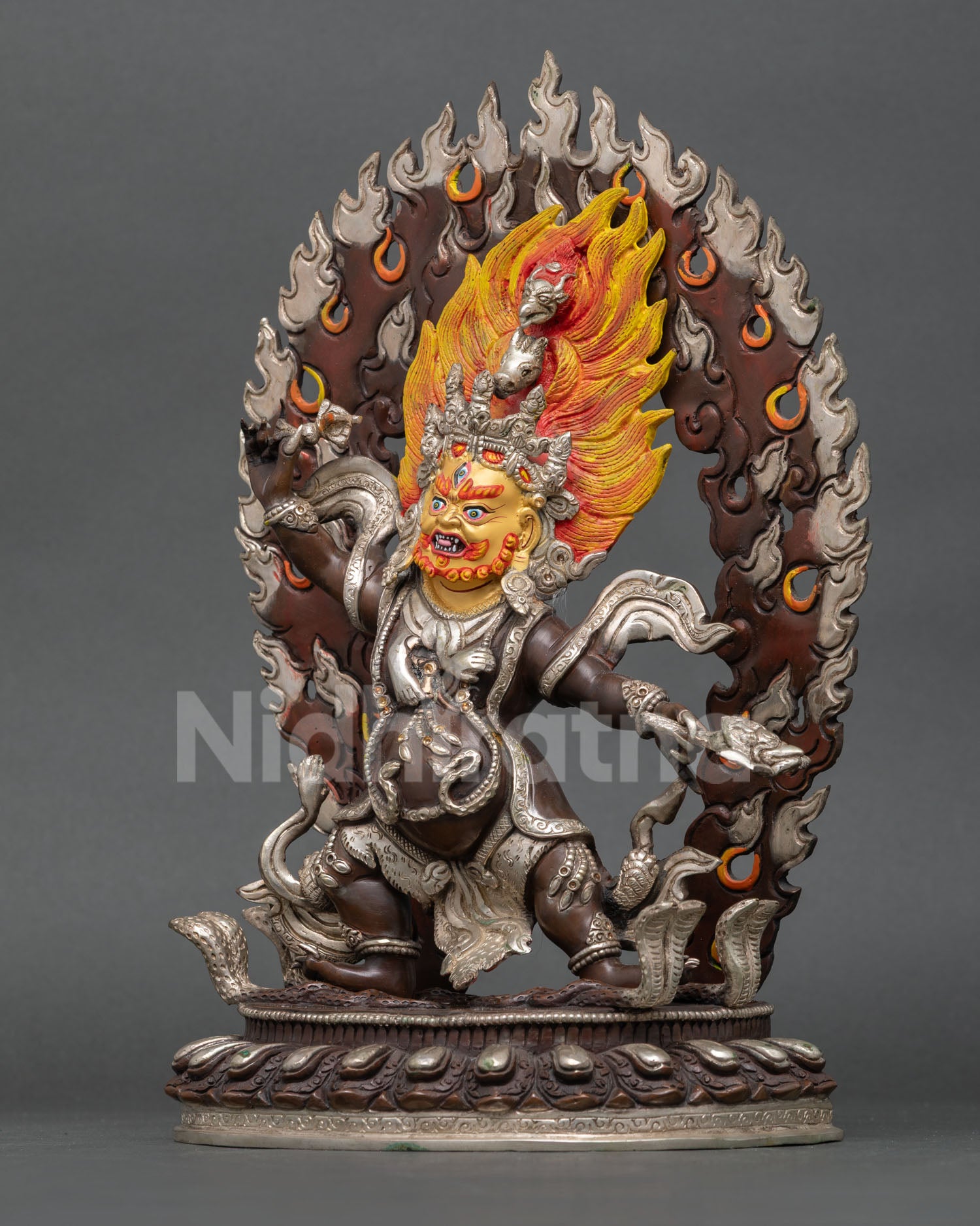 Left side view of Trakpo Sumtril statue, handcrafted Nepalese Buddhist art with oxidized copper finish