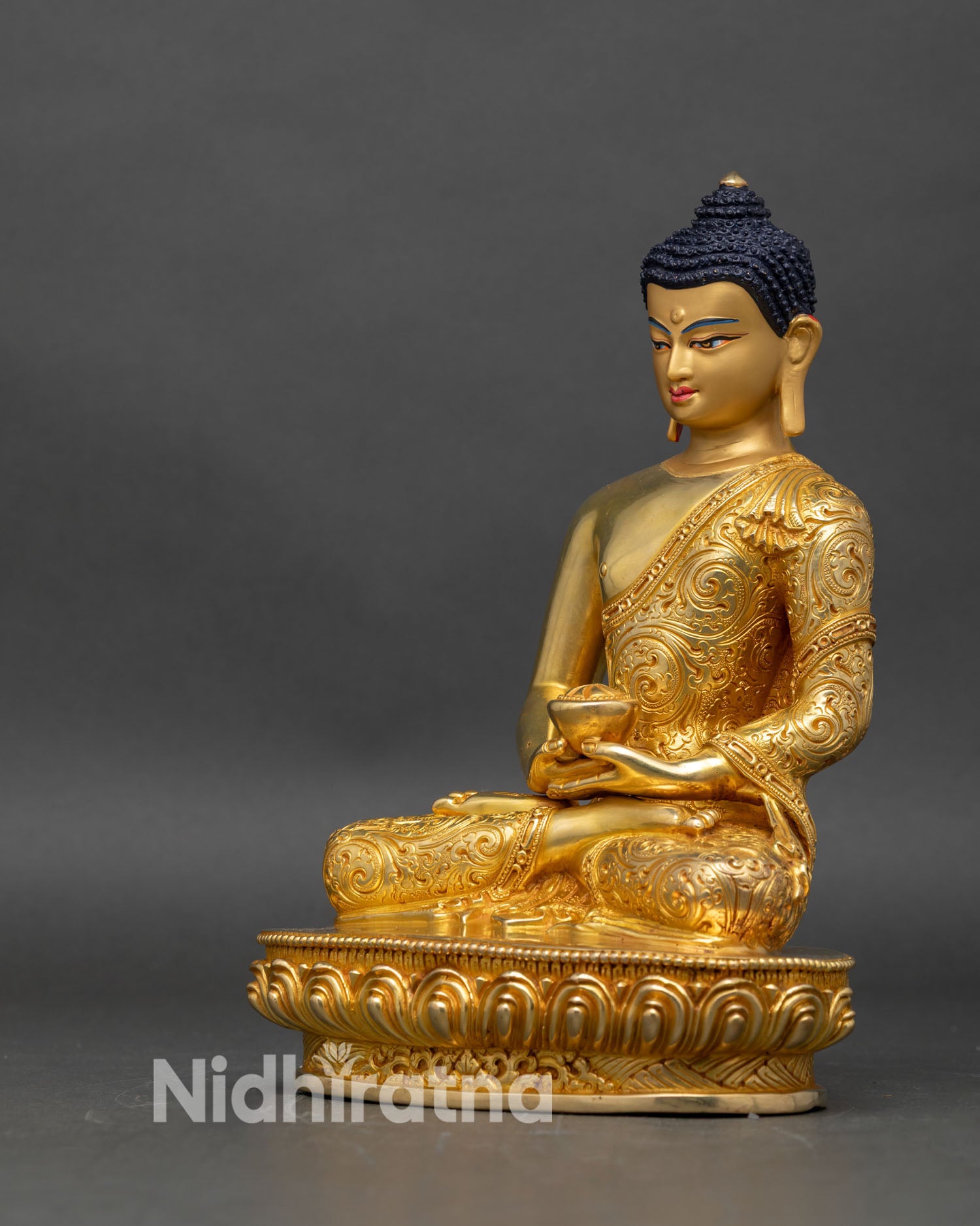 Left side view of Amitabha Buddha statue, copper and gold, traditional craftsmanship