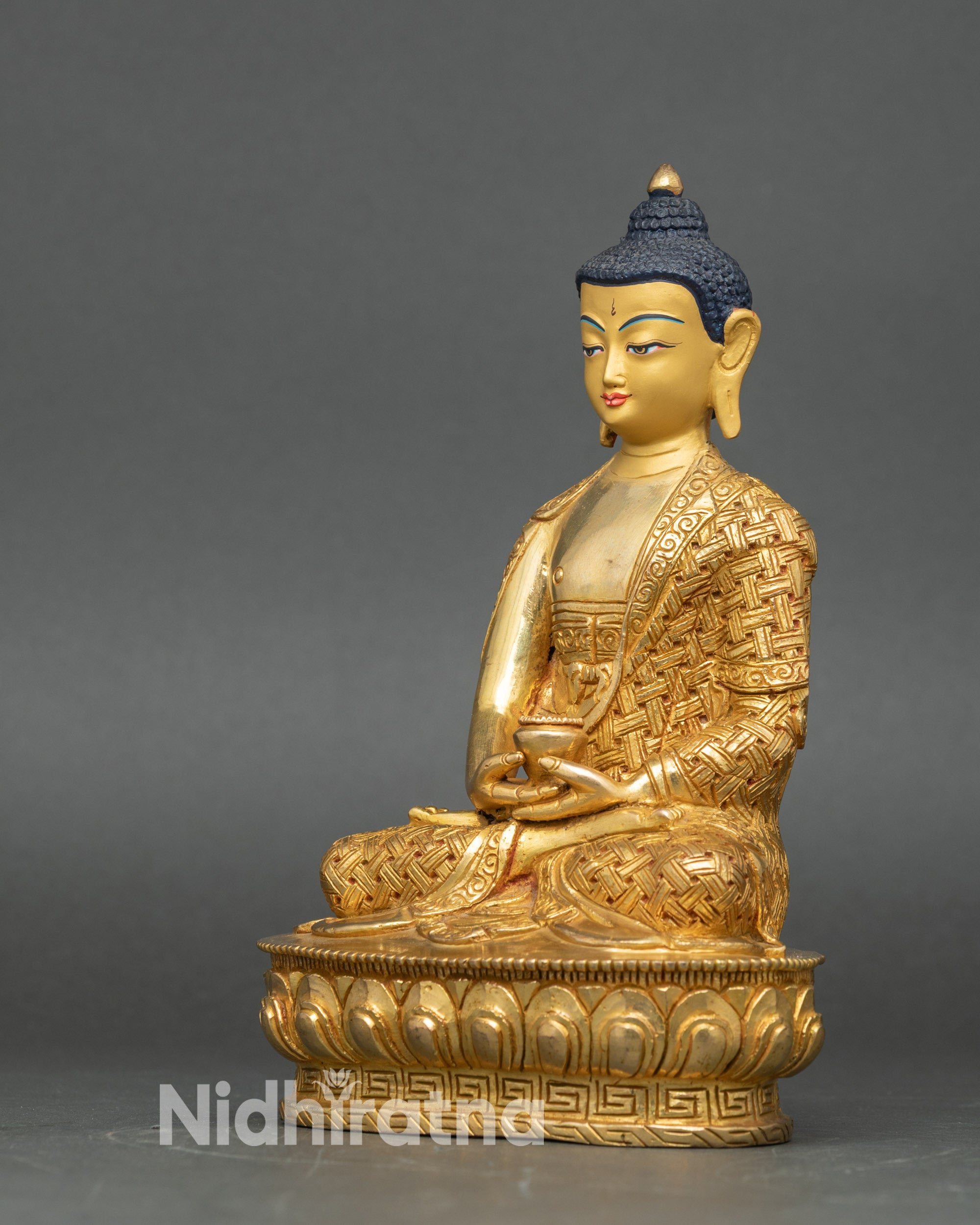Left-side view of Amitabha Buddha statue, gold fire-gilded copper with detailed lotus throne