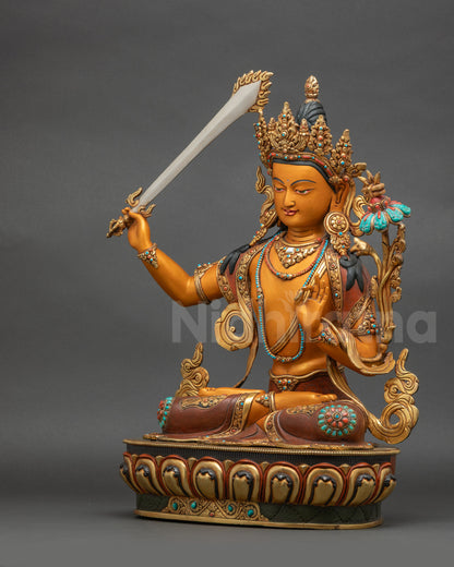 Left-side view of Manjushri wisdom statue holding utpala flower and sacred sutra