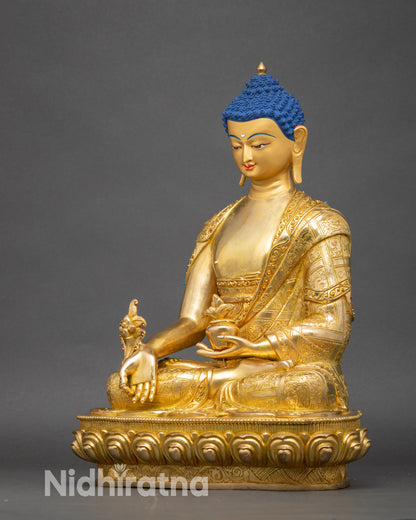 Left-side view of Medicine Buddha statue, handcrafted copper with gold finish