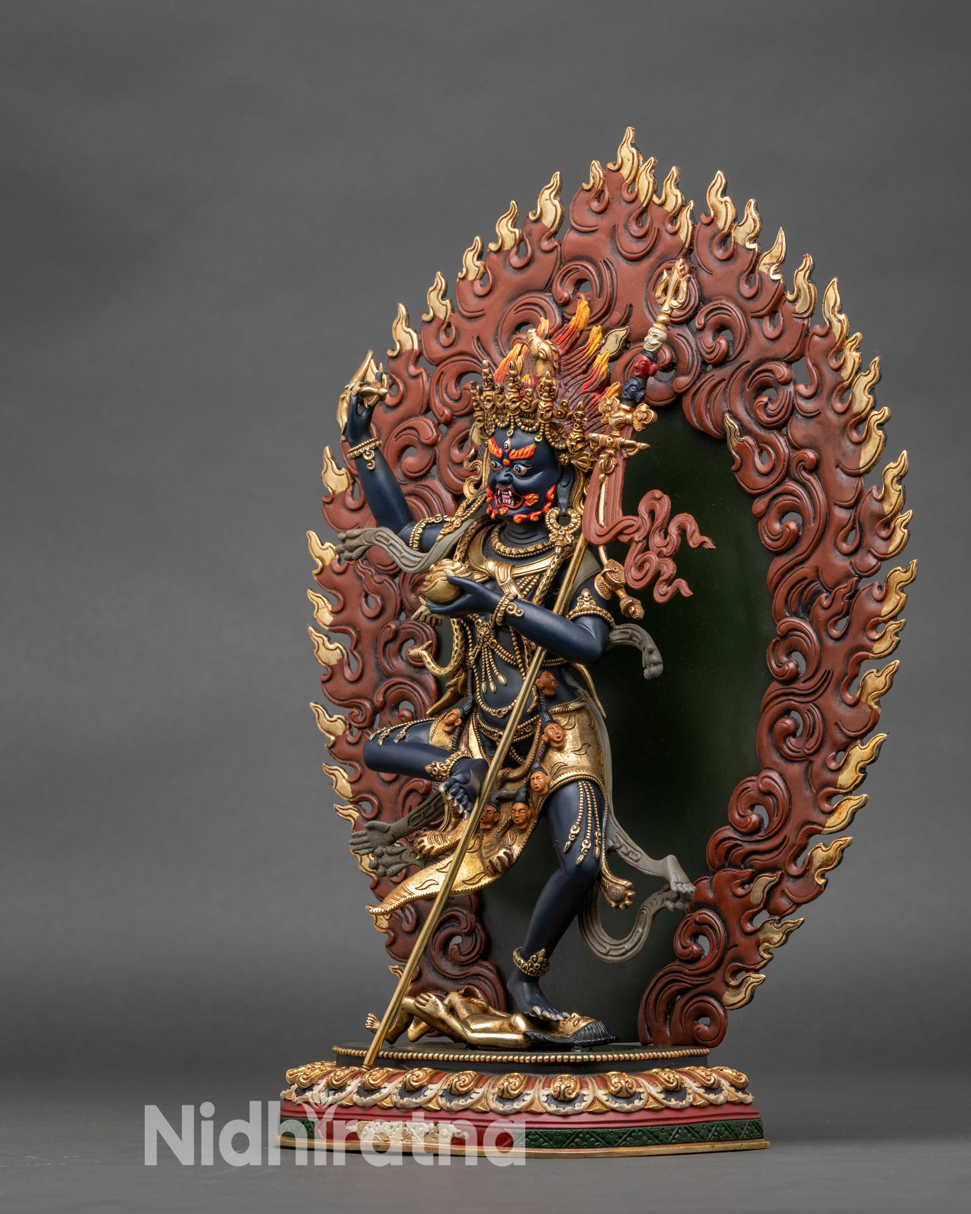 Left-side view of Troma Nagmo statue, detailed copper and gold craftsmanship