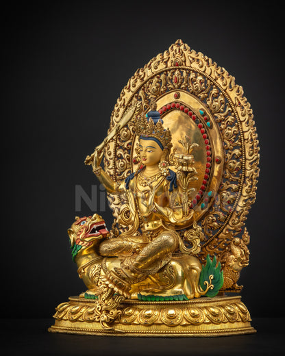 Left-side view of lion-seated Manjushri sculpture with gold fire-gilded carvings and symbolism