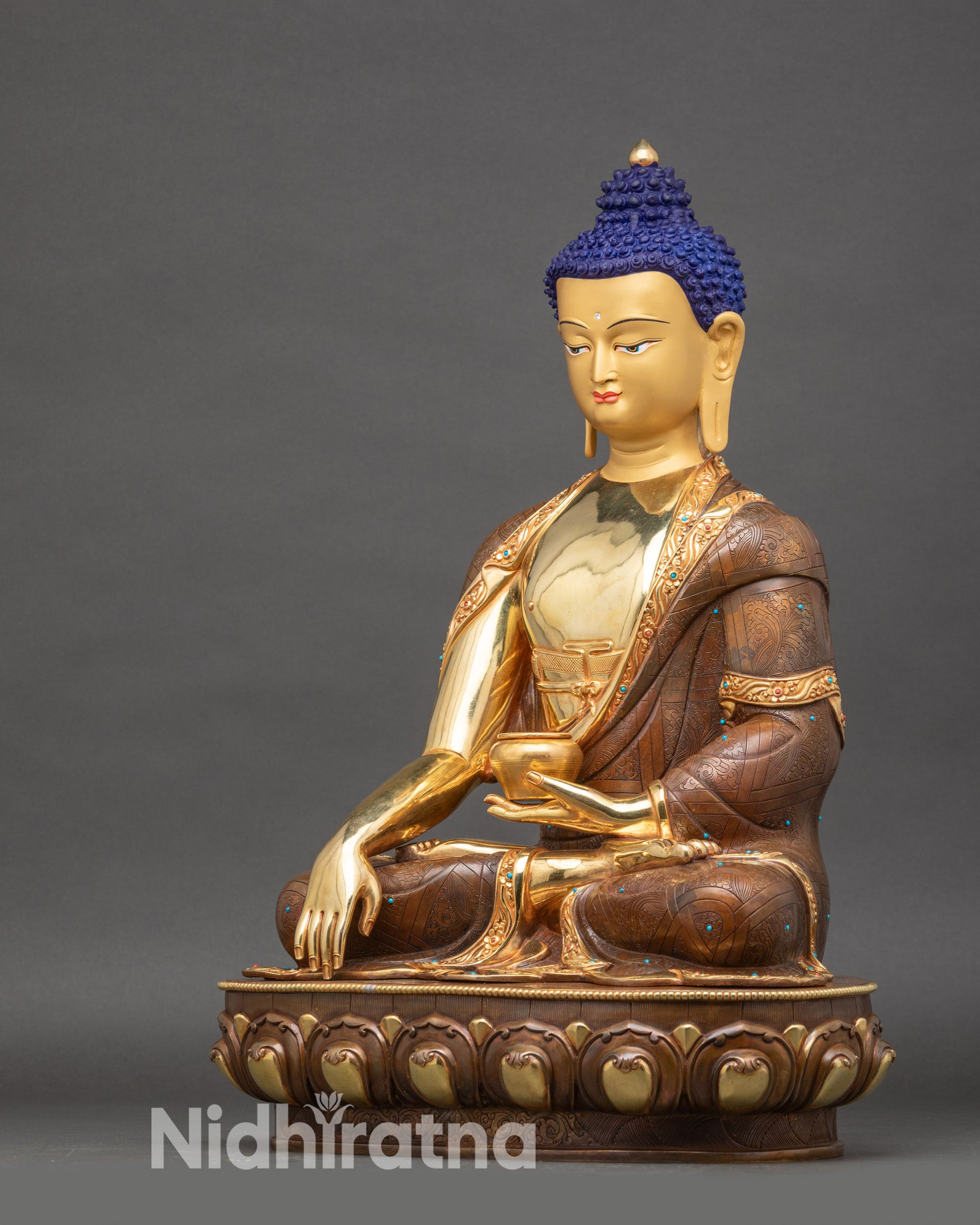 Left profile of Buddha Statue, copper and gold Himalayan altar sculpture