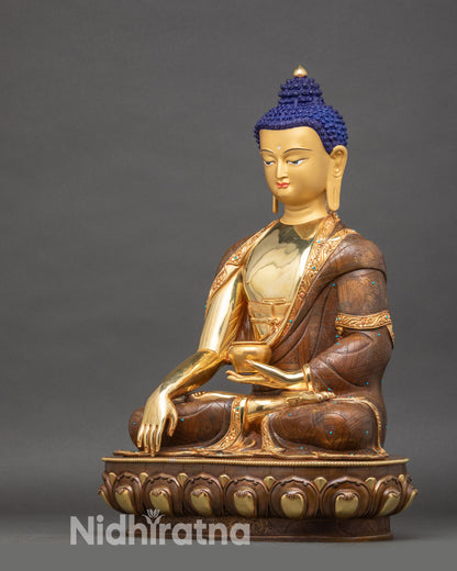 Left profile of Buddha Statue, copper and gold Himalayan altar sculpture