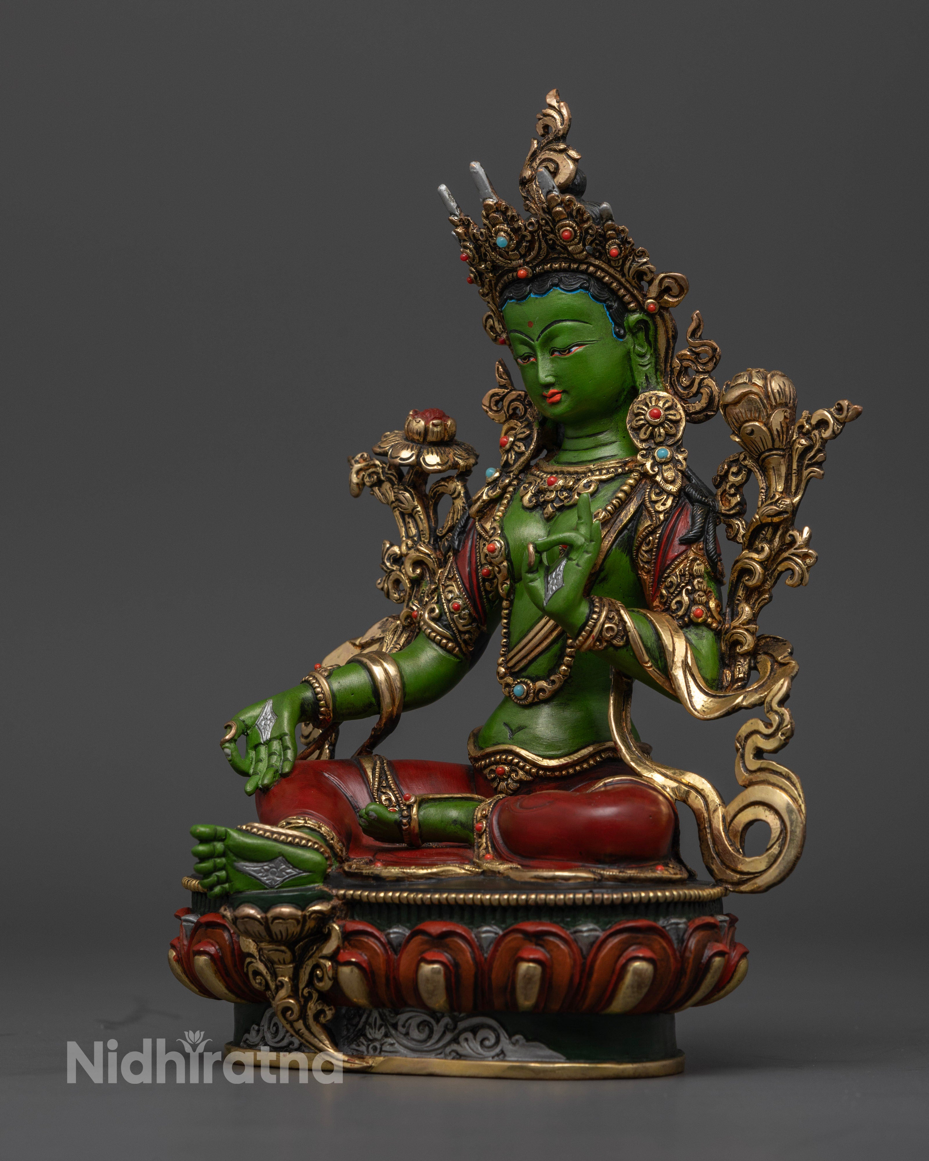 It highlight left side of Green Tara showing Vitarka mudra and exceptinal detailing on crown & jewelry