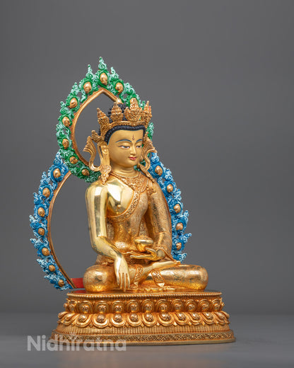 Left angle of Buddha sculpture showing patra bowl and painted monastic robe