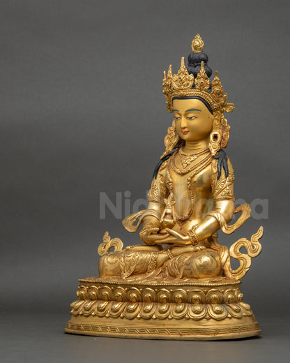 Left profile of Amitayus statue with serene expression and hand-painted gold face