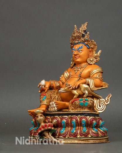 Left profile of Dzambhala God of Wealth with semi precious stone adornments