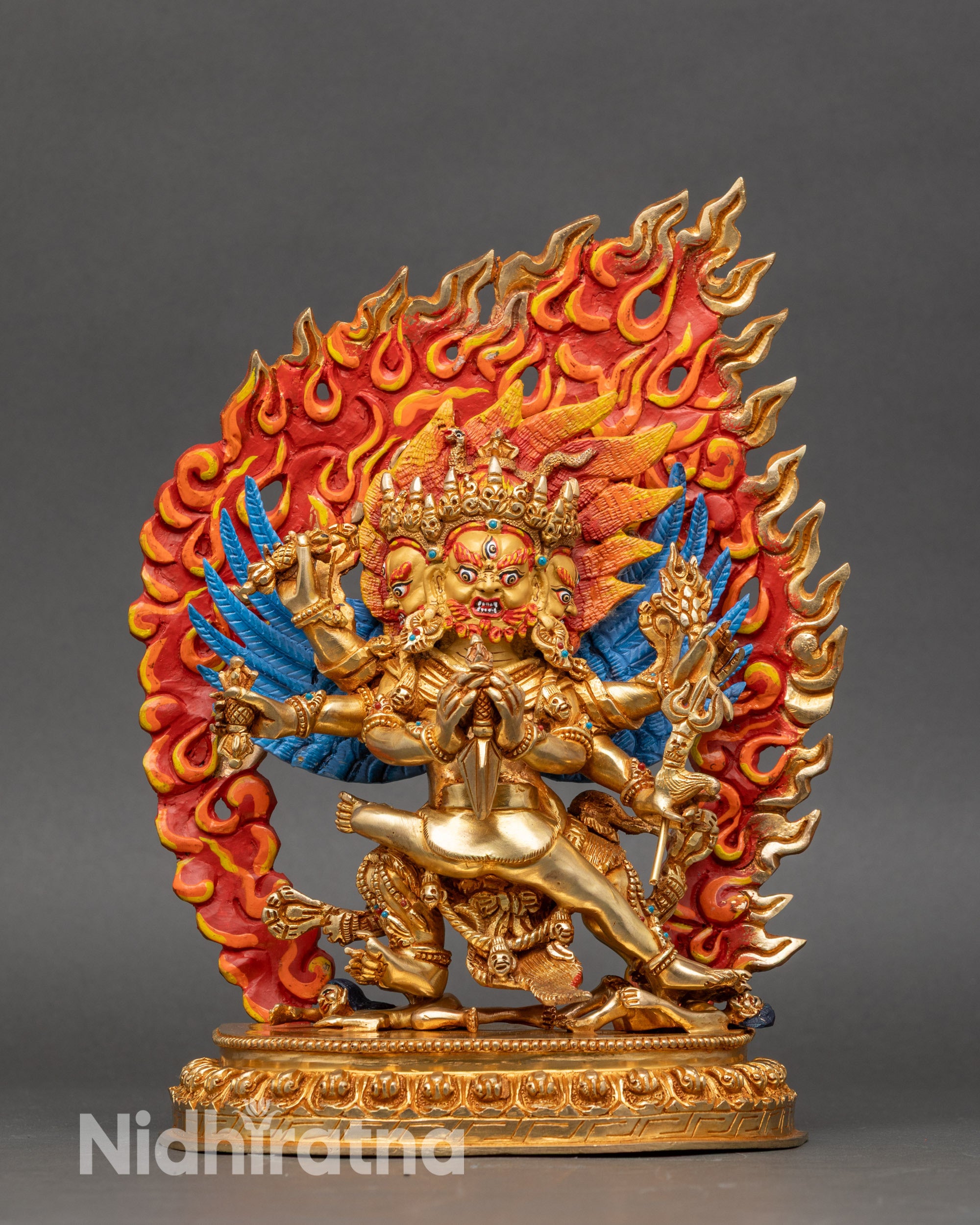 Left profile of Hayagriva statue showing multiple arms and ornate halo