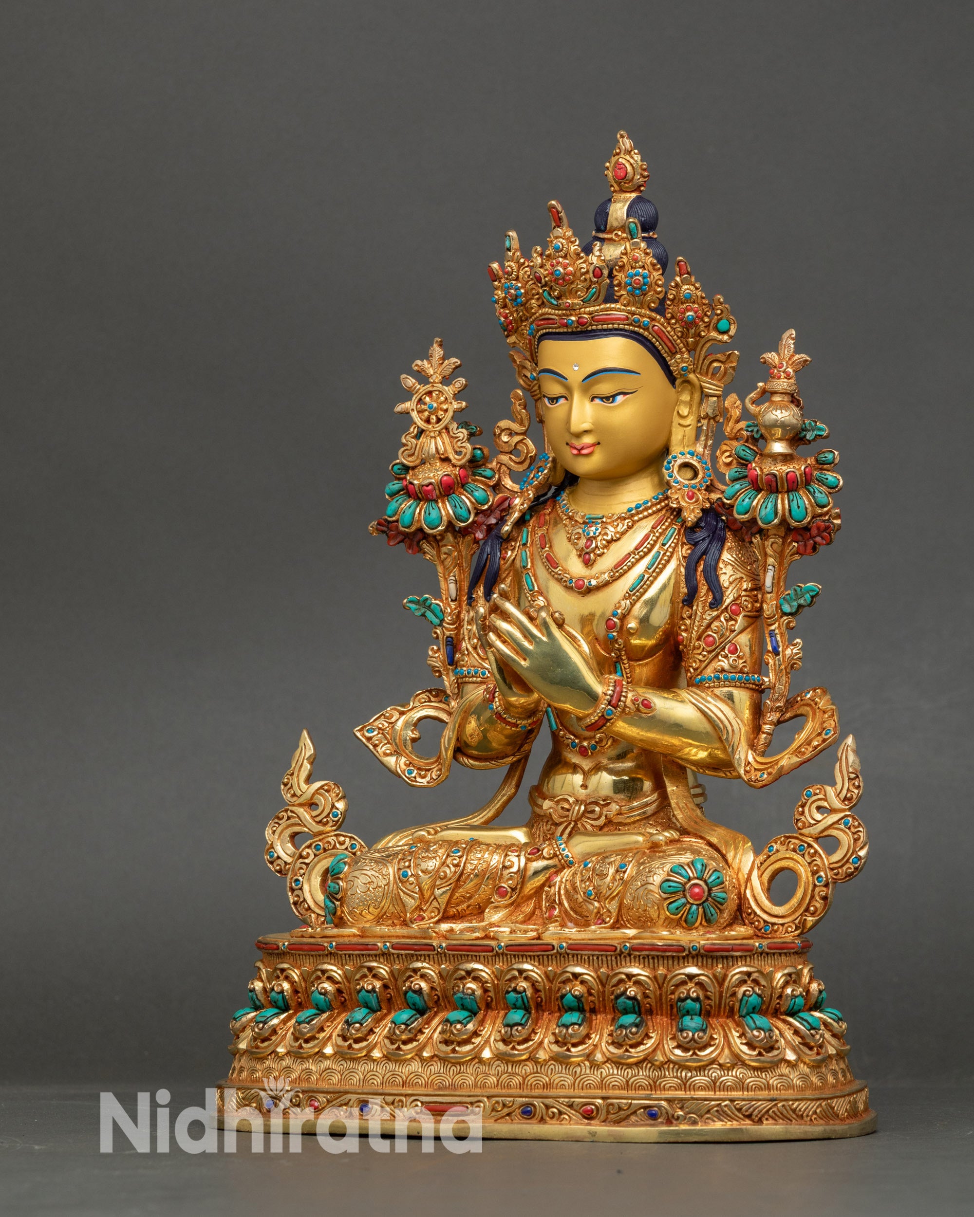 Left profile of Maitreya Buddha with sacred Wheel of Dharma and Kalasha details