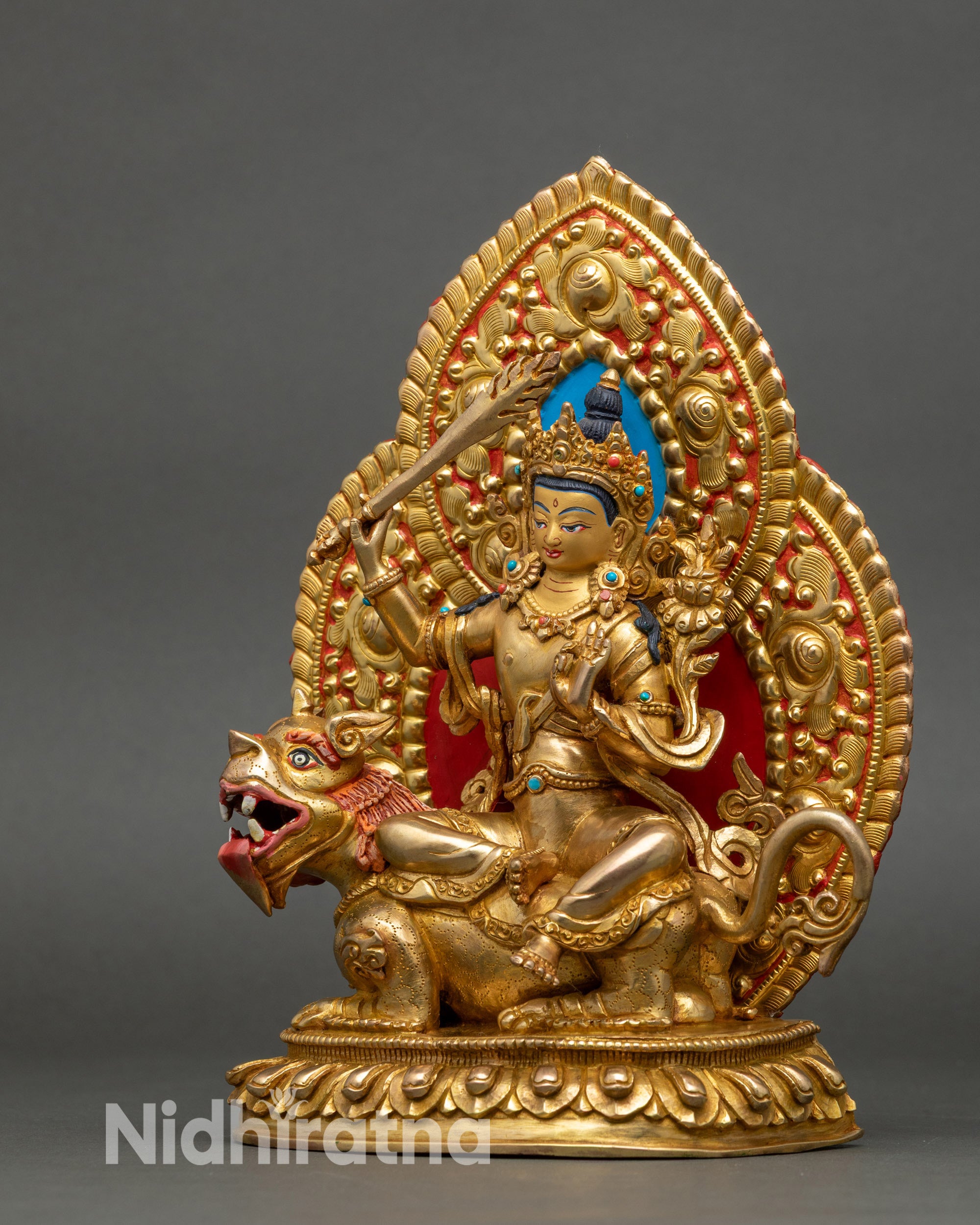 Left profile of Manjushri statue, Snow Lion seat and gold fire-gilding details