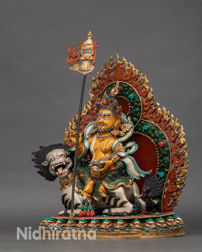 Left profile of Namtoshe figurine, depicting jewel-spilling mongoose and sacred symbolism