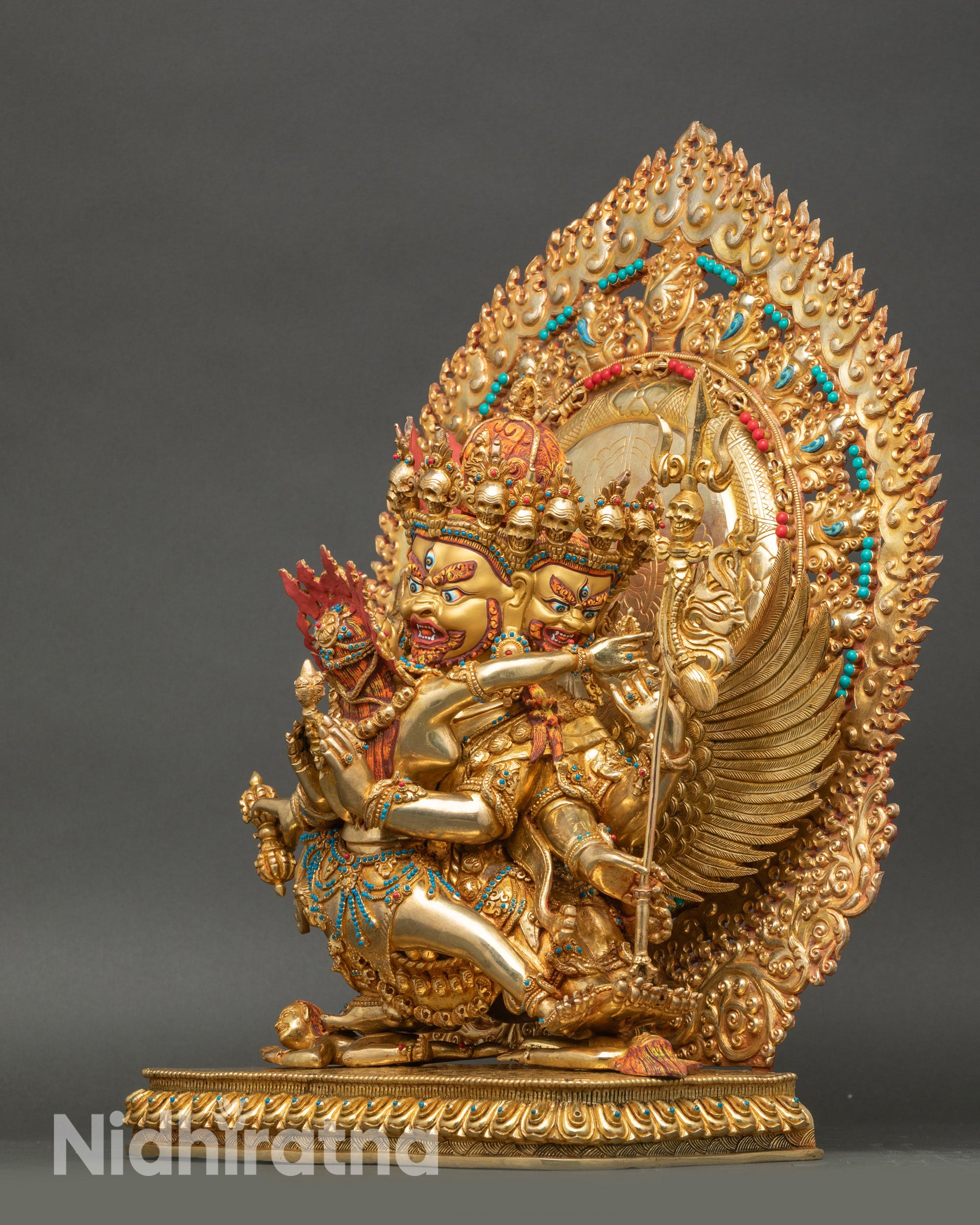 Left profile of Vajrakilaya Yab-Yum statue showing tantric attributes and gold accents