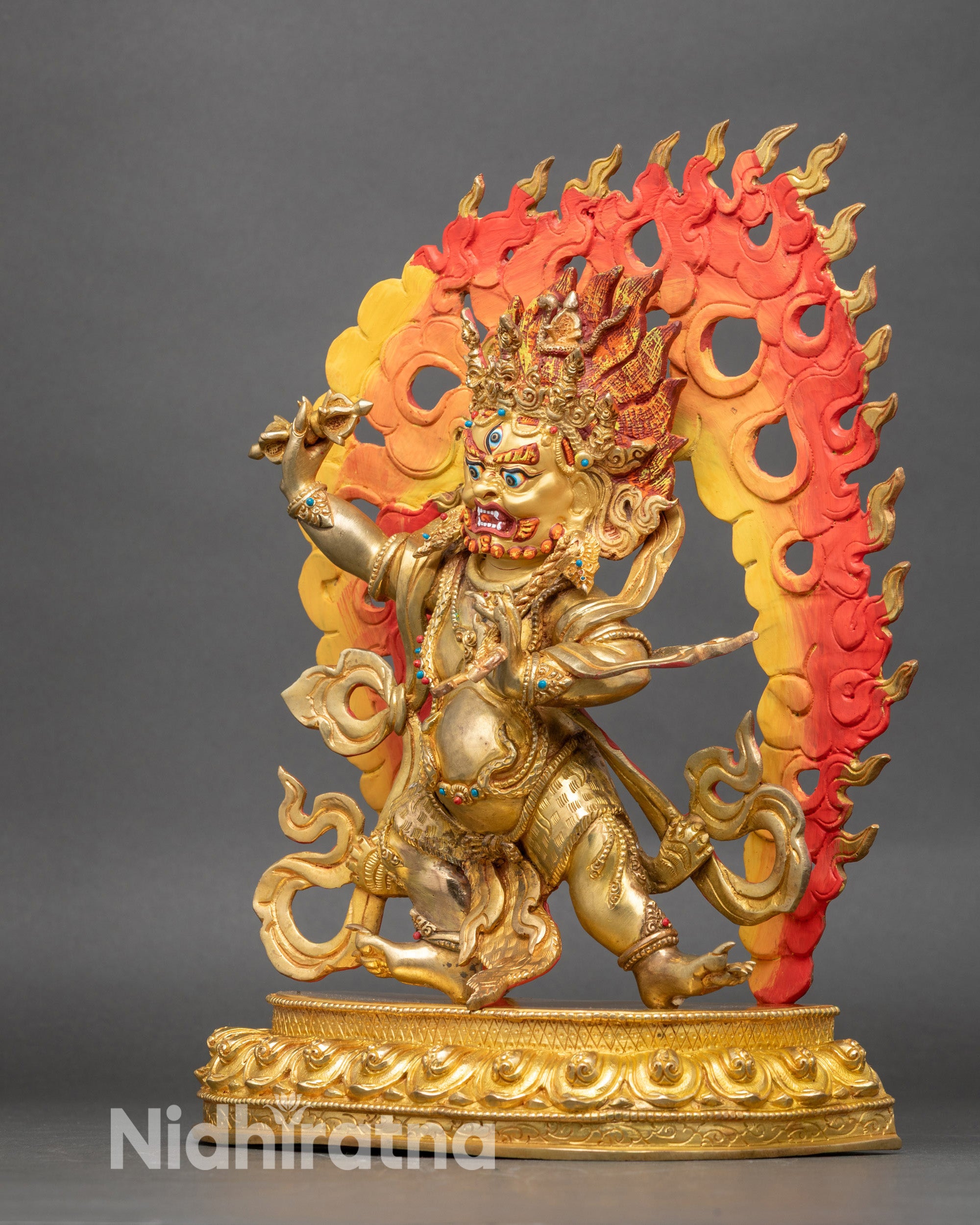 Left profile of Vajrapani statue highlighting semi-precious inlays and detailed jewelry