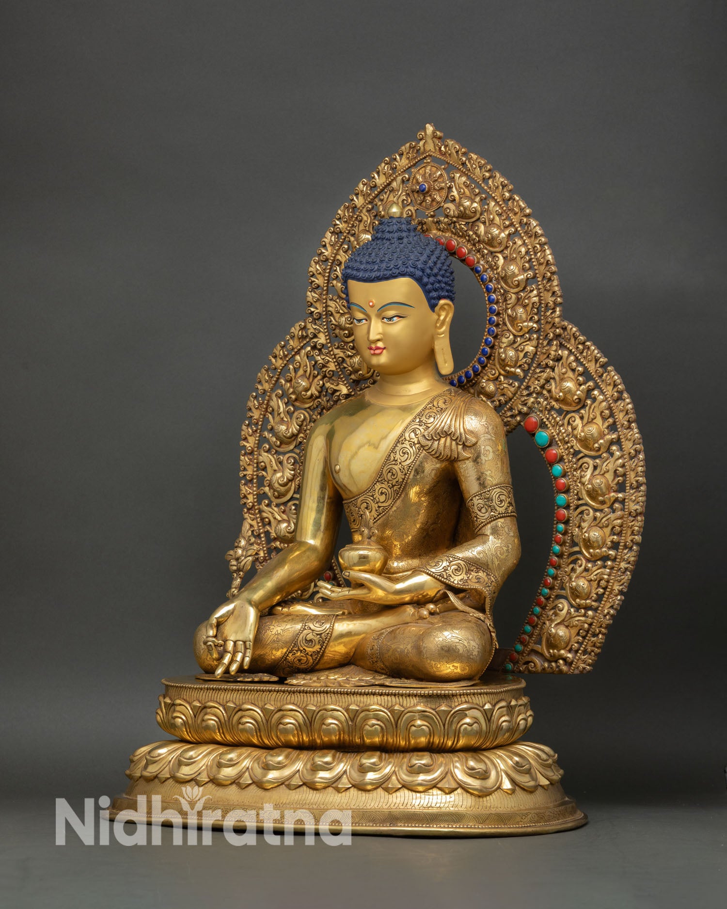 Left side Medicine Buddha statue lotus throne draped robe copper gold Himalayan art