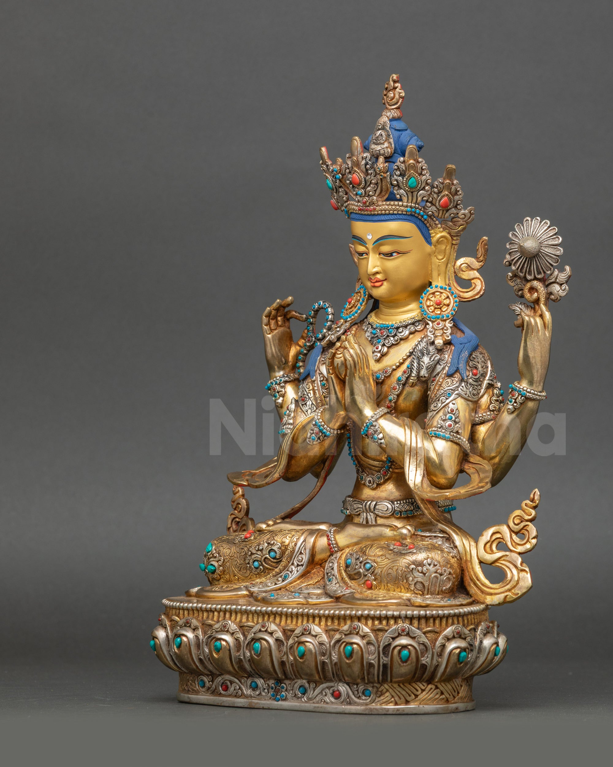 Left side of Avalokiteshvara statue showing intricate lower garment patterns