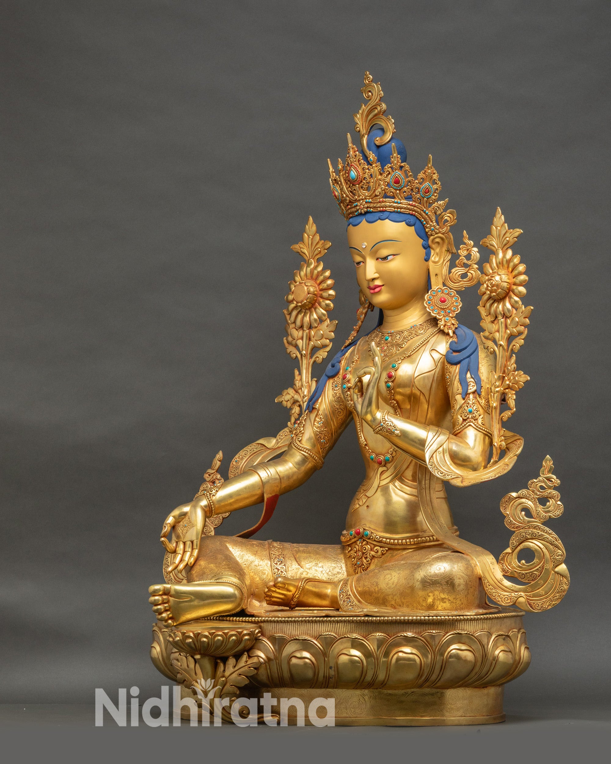 Left side of Green Tara Bodhisattva statue, gold face, devotional altar sculpture