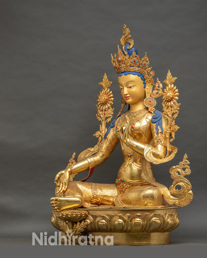 Left side of Green Tara Bodhisattva statue, gold face, devotional altar sculpture
