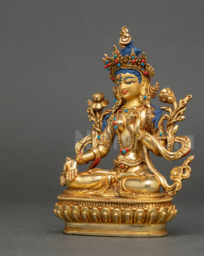 Left side of White Tara Statue with detailed carved lotus seat and floating robe
