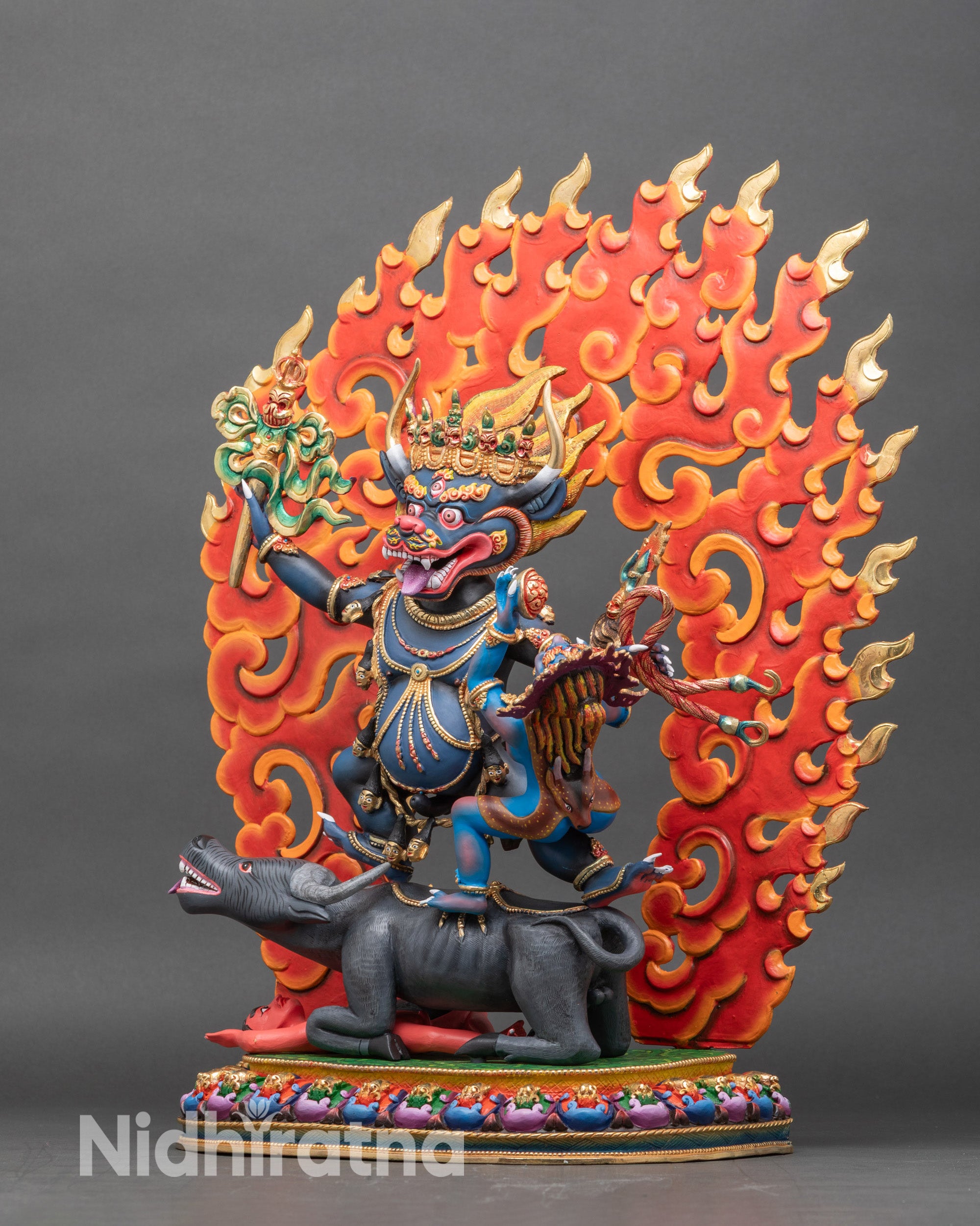 Left side of Yamantaka statue highlighting raised arm and detailed ornamental feature