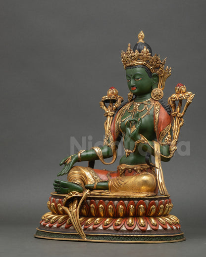 Left side profile of Green Tara statue highlighting painted details and gold accents
