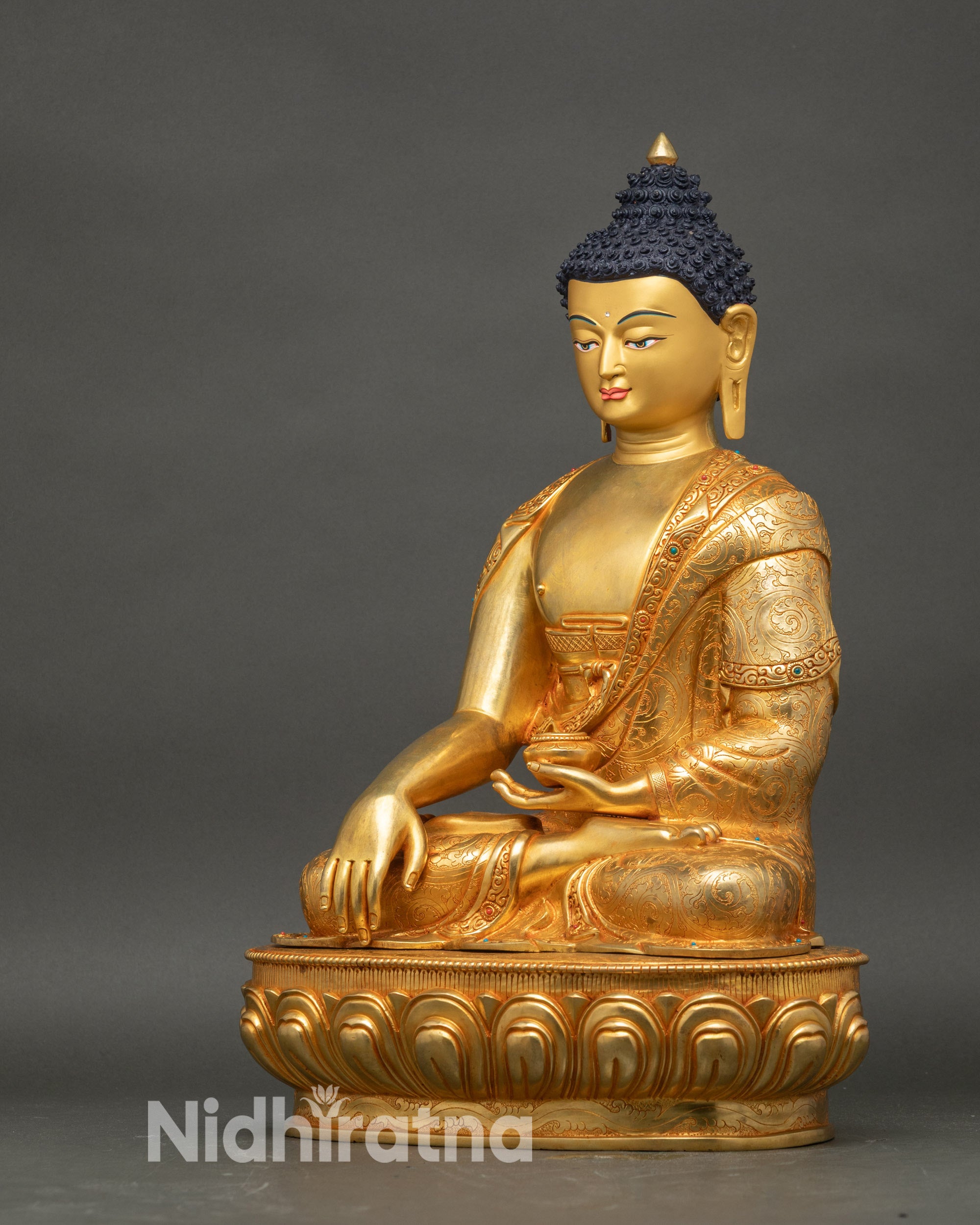 Left side profile of Shakyamuni Buddha earth touching mudra gold gilded statue