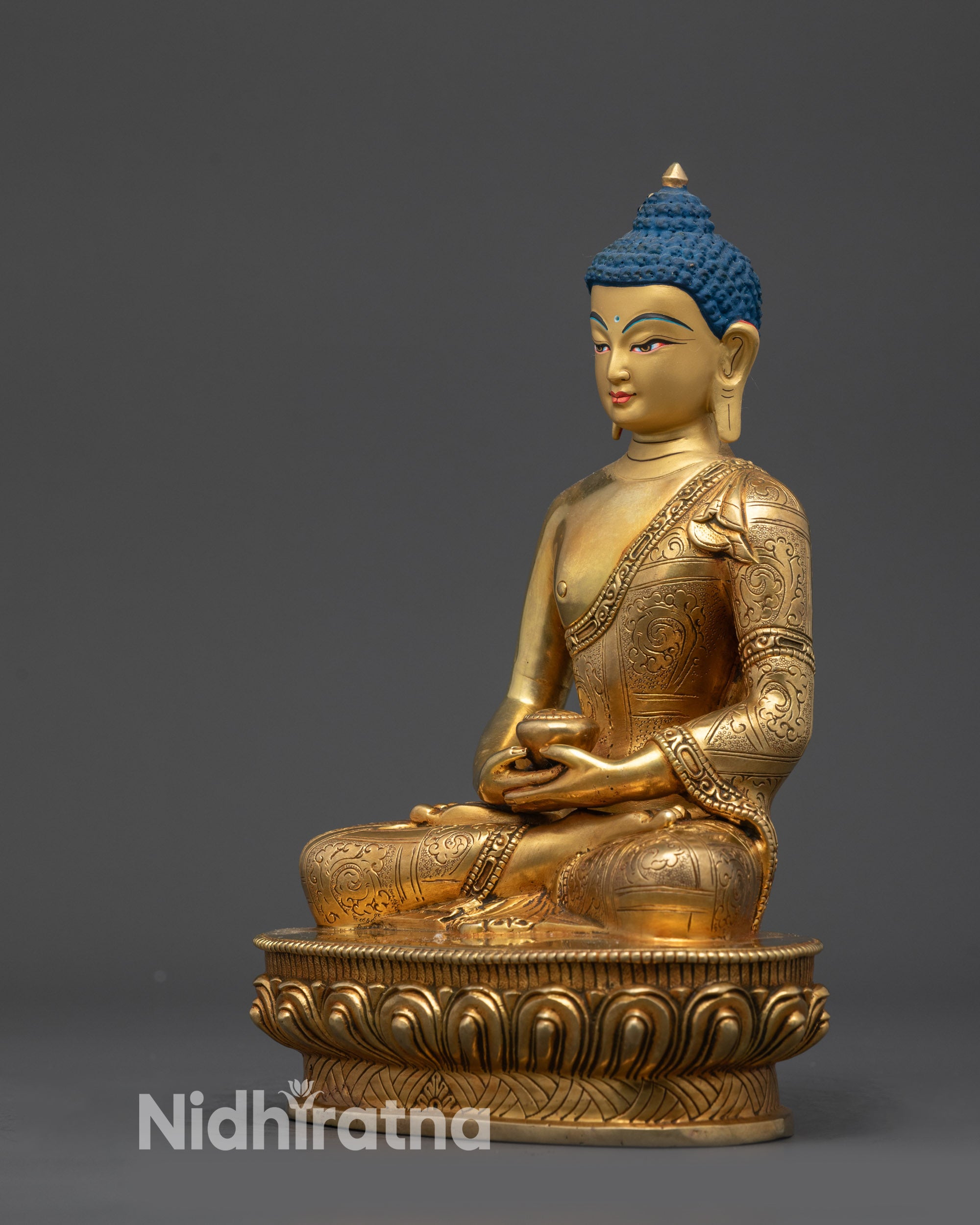 Left side view Amitabha statue highlighting patterned robe and lotus seat details