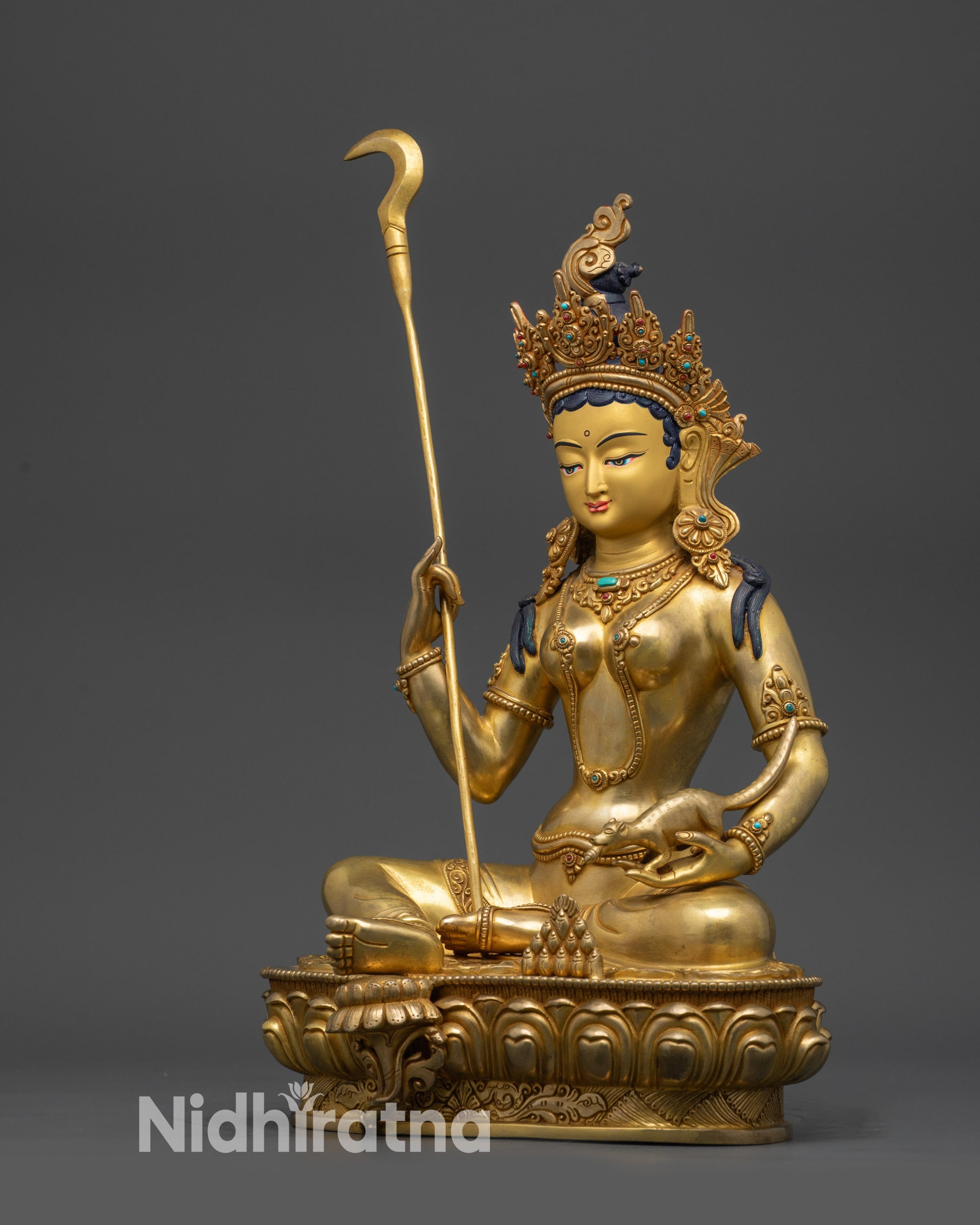 Left side view Red Manohara Vasudhara Buddhist statue holding prosperity symbols
