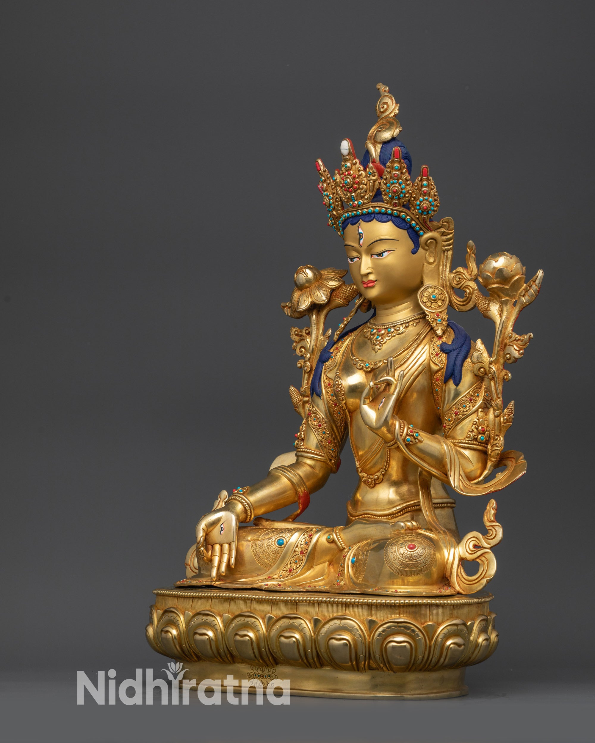 Left side view White Tara Statue with utpala flower and detailed jewelry