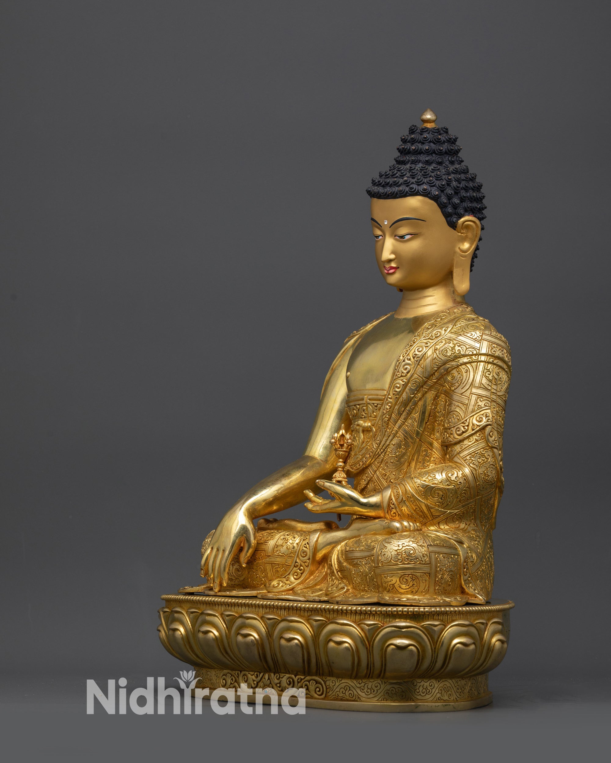 Left side view of Akshobhya Buddha Mitrugpa statue seated on lotus pedestal for meditation
