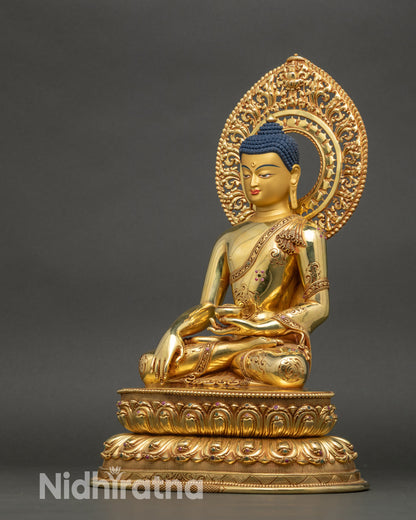 Left side view of Buddha sculpture, detailed robes and lotus pedestal craftsmanshi