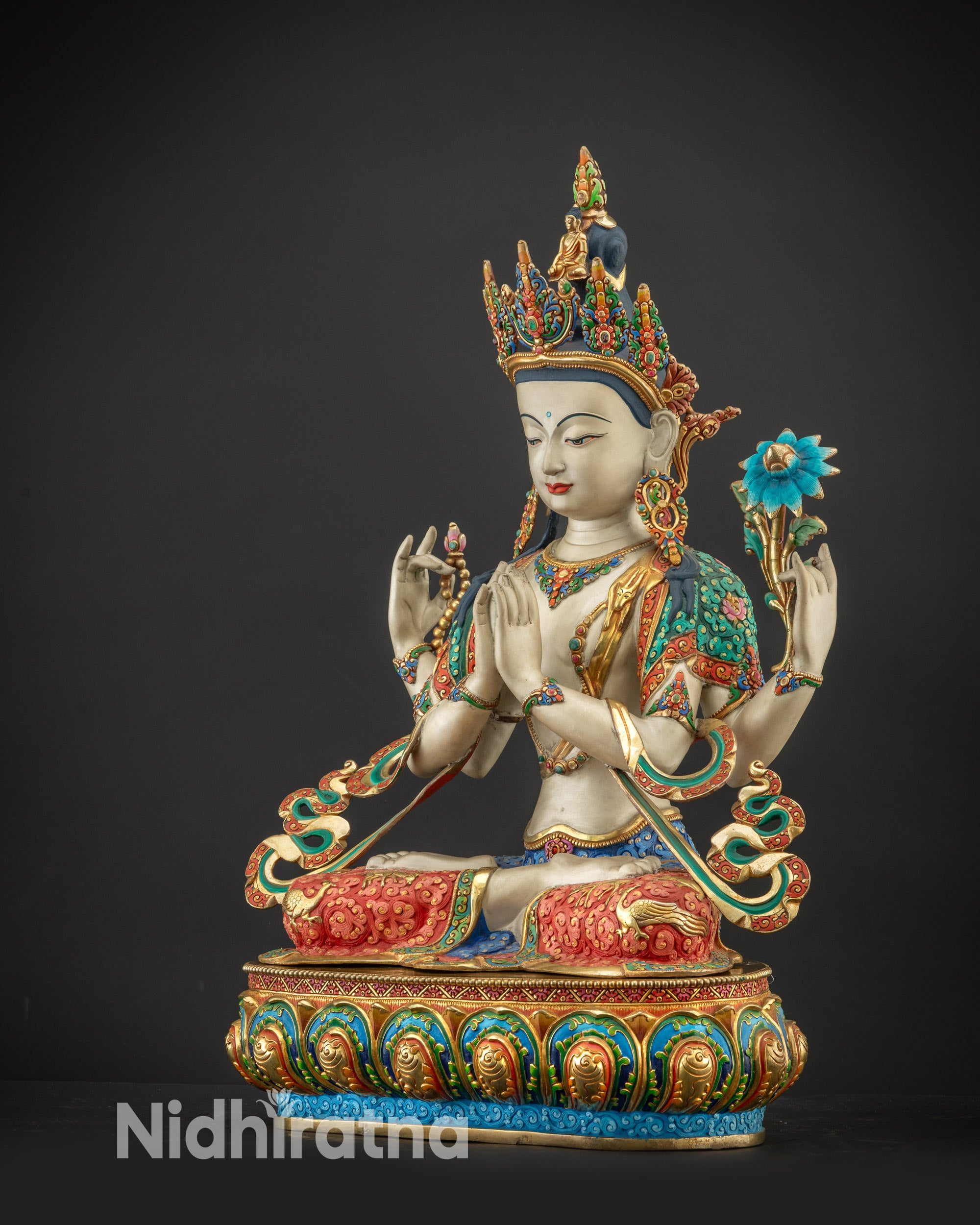 Left side view of Chenrezig Statue displaying gold-plated robes and carved lotus seat