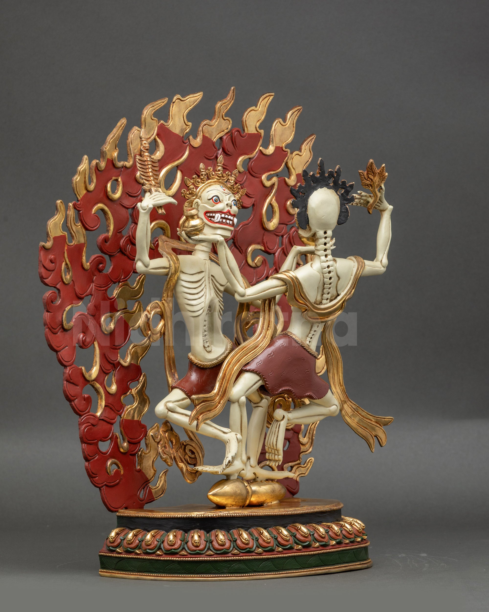 Left side view of Citipati Statue showing gold-plated robes and lower silk cloths
