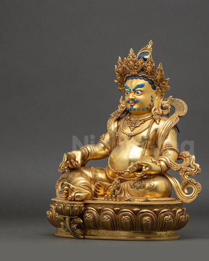 Left side view of Dzambhala gold-gilded copper Dzambhala deity