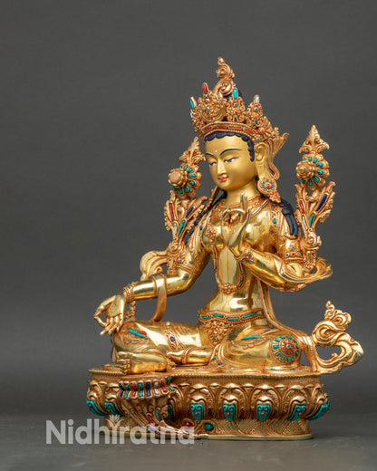 Left side view of Green Tara Bodhisattva statue with detailed robe and jewelry