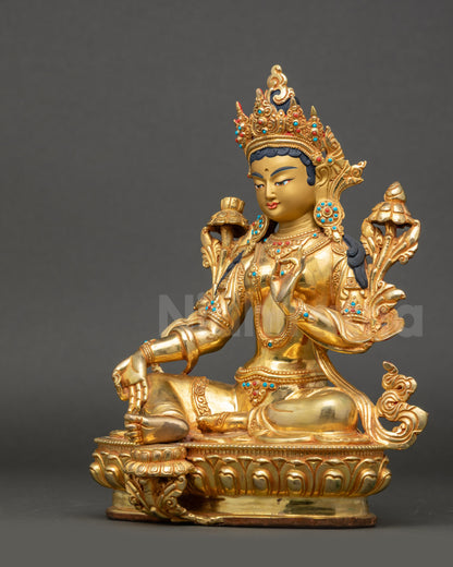 Left side view of Green Tara Figurine highlighting gold-gilded robes and crown